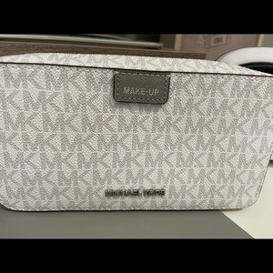 Grey and white Michael Kors makeup pouch!